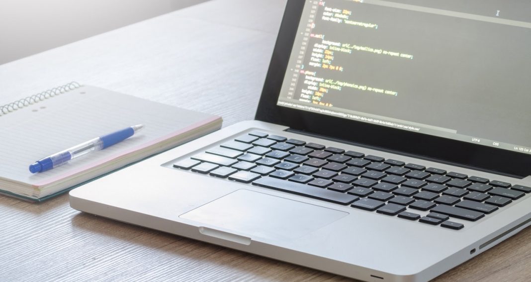 a laptop and a notebook on the table